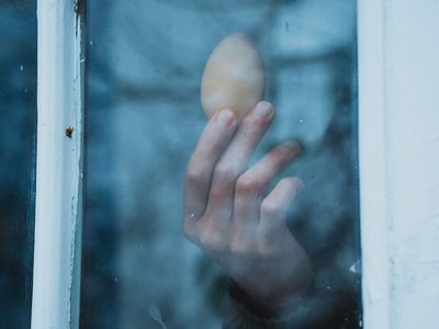 Hands gently framing a view, symbolizing control and focus.